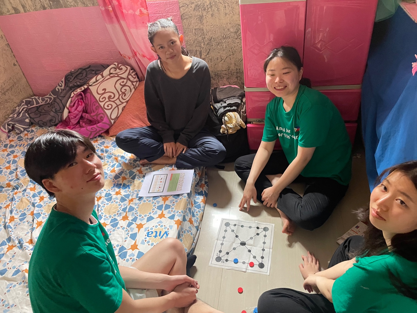 An afternoon of games during a family visit, because the work is about showing up, not just sending money.