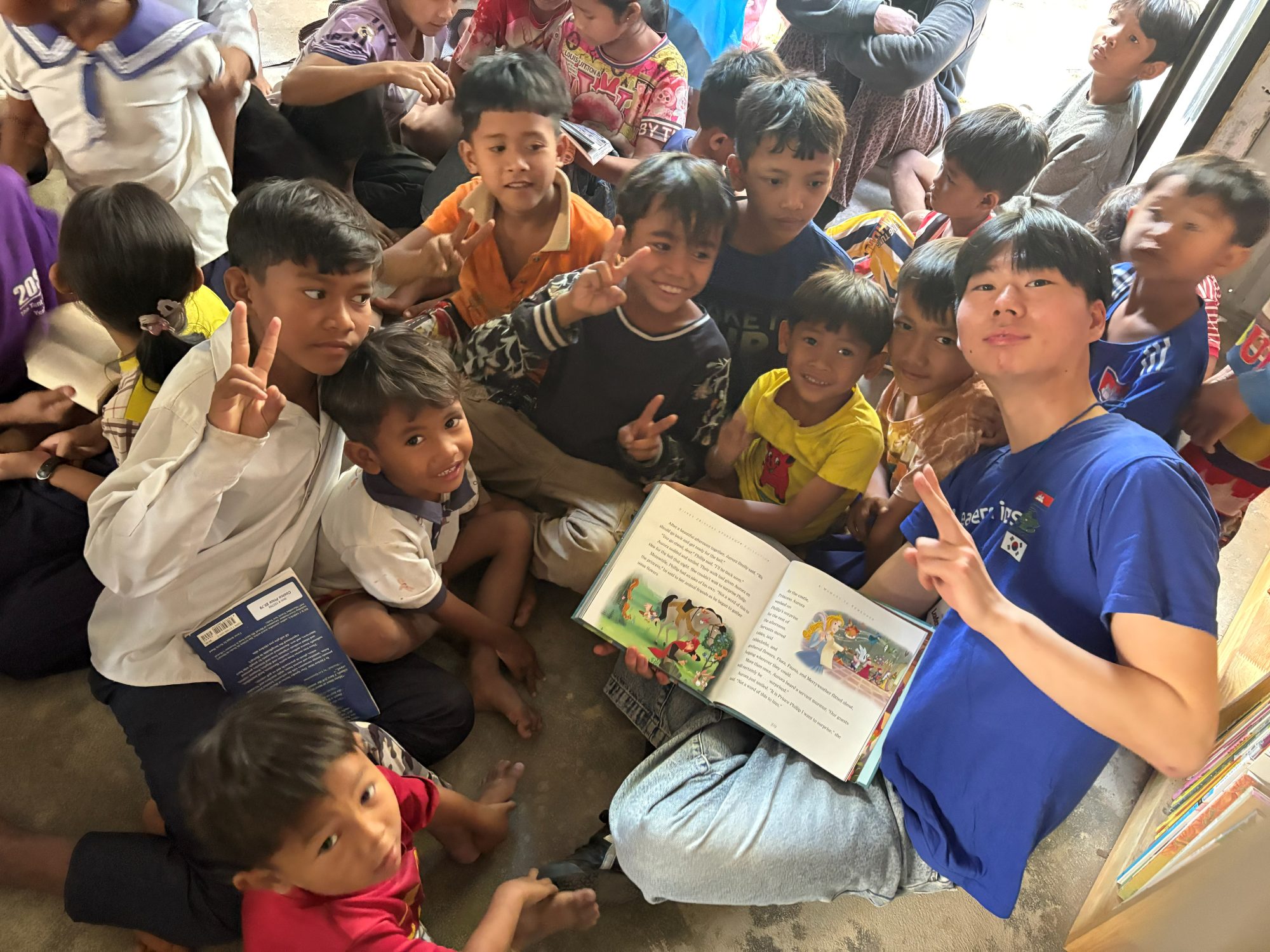 Reading together with children at one of the three Lumen libraries we built inside local churches in Siem Reap.