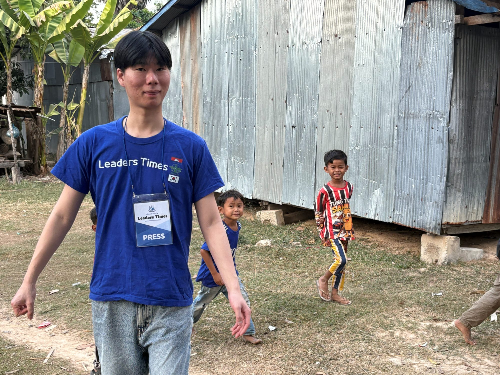 Walking the village with local children, the readers Lumen Education was built for.