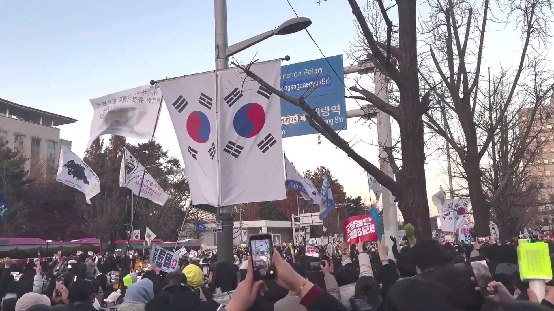 Street protests during the impeachment crisis, a still from the documentary; scenes like this are where the fight over Korea's media plays out.