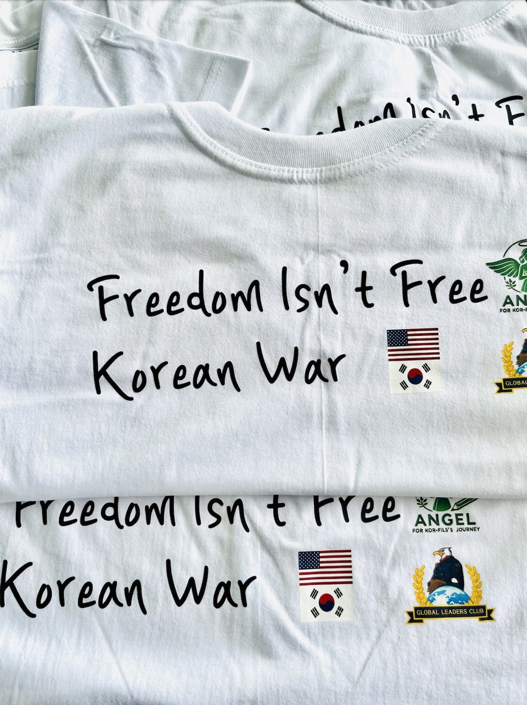The 'Freedom Isn't Free' t-shirts we designed and sold to fund the flower-wreath donations at the UN Memorial Cemetery.